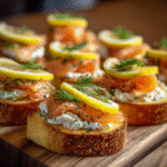 smoked salmon crostini platter with cream cheese and lemon